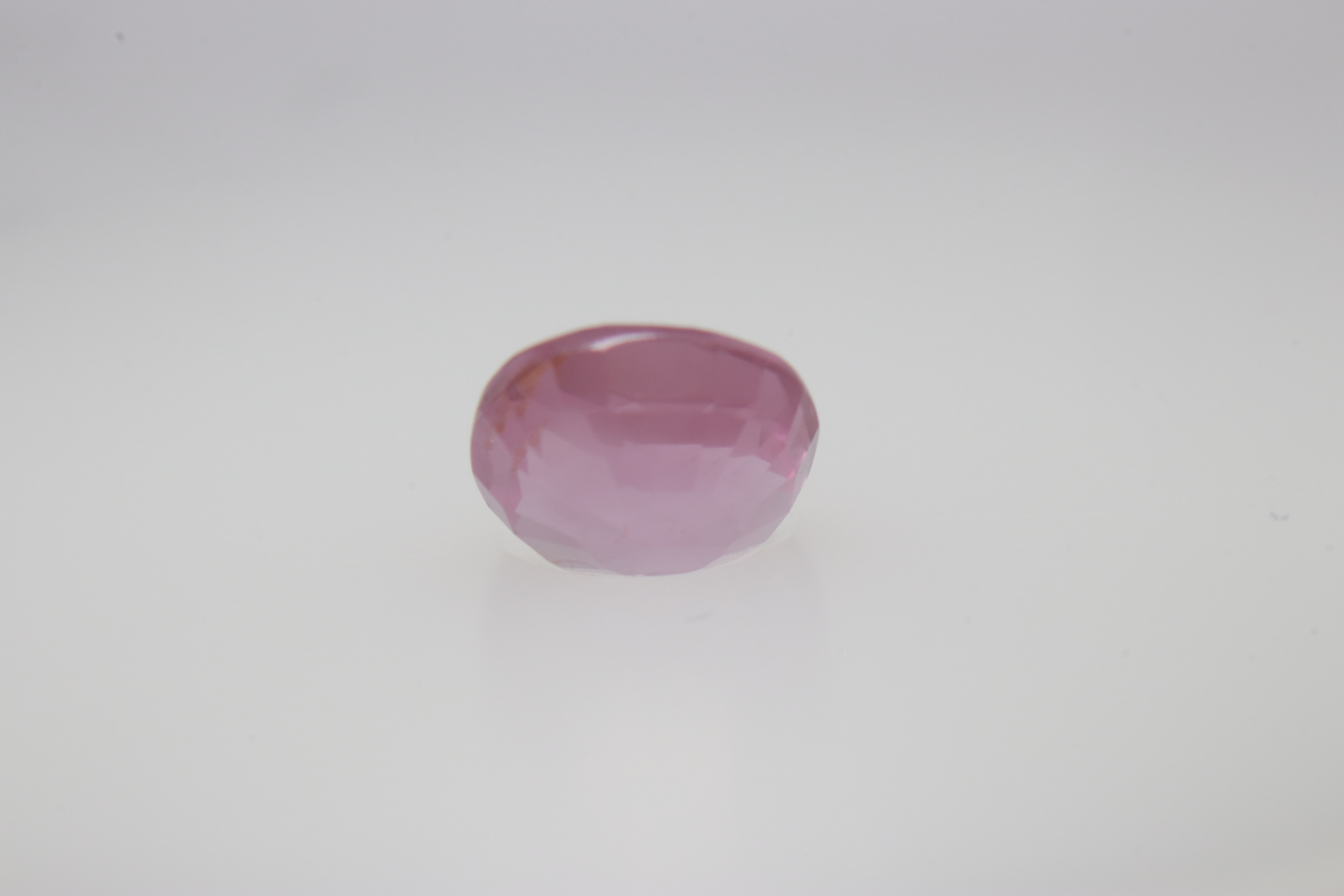 0.6ct Hot Pink Padparadscha VVS Oval Shape (5.2x4.6x3.1 mm) Unheated gemstone from Sri Lanka