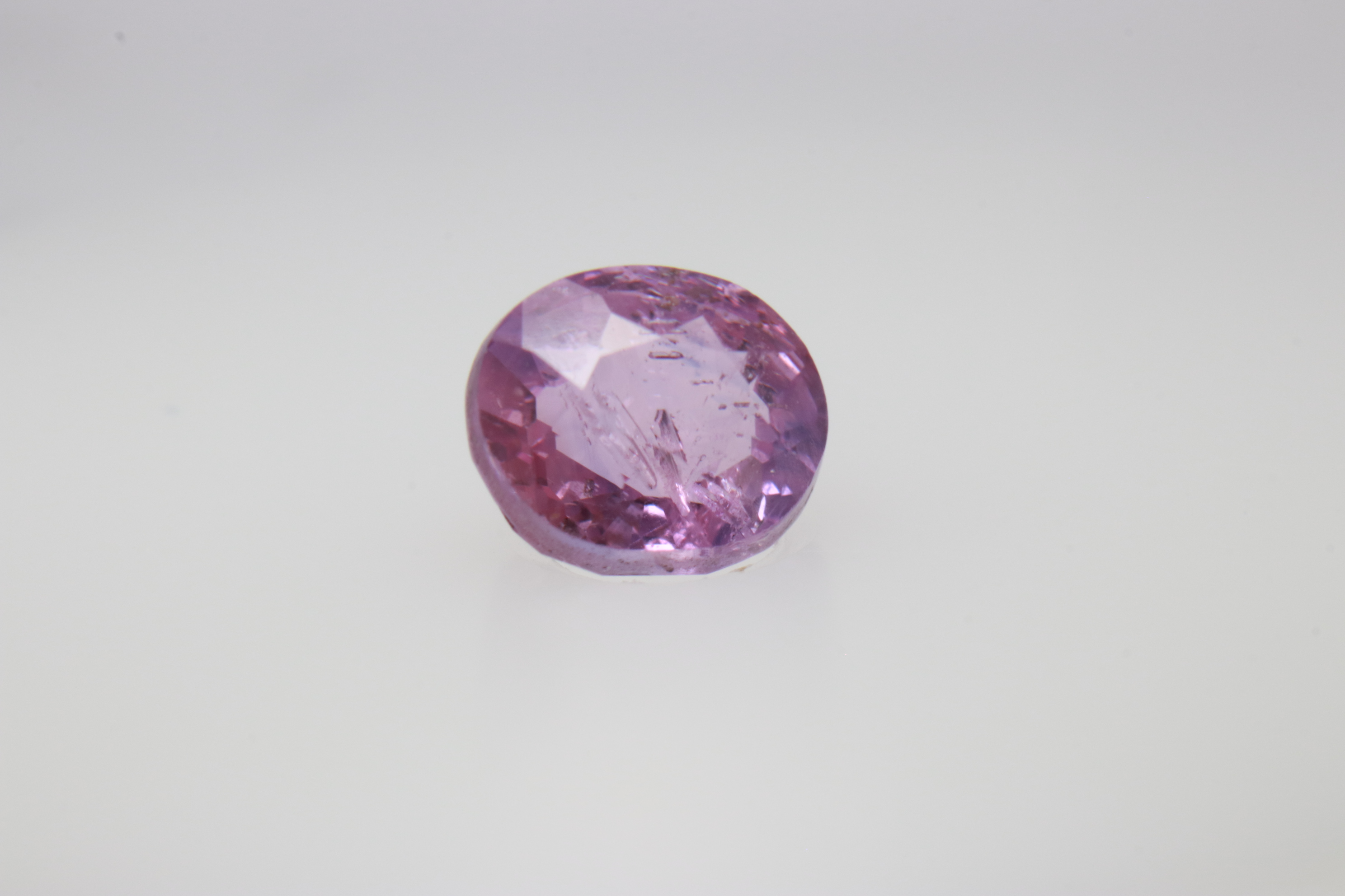 0.9ct Hot Pink Padparadscha VVS Oval Shape (5.8x4.8x3.5 mm) Unheated gemstone from Sri Lanka