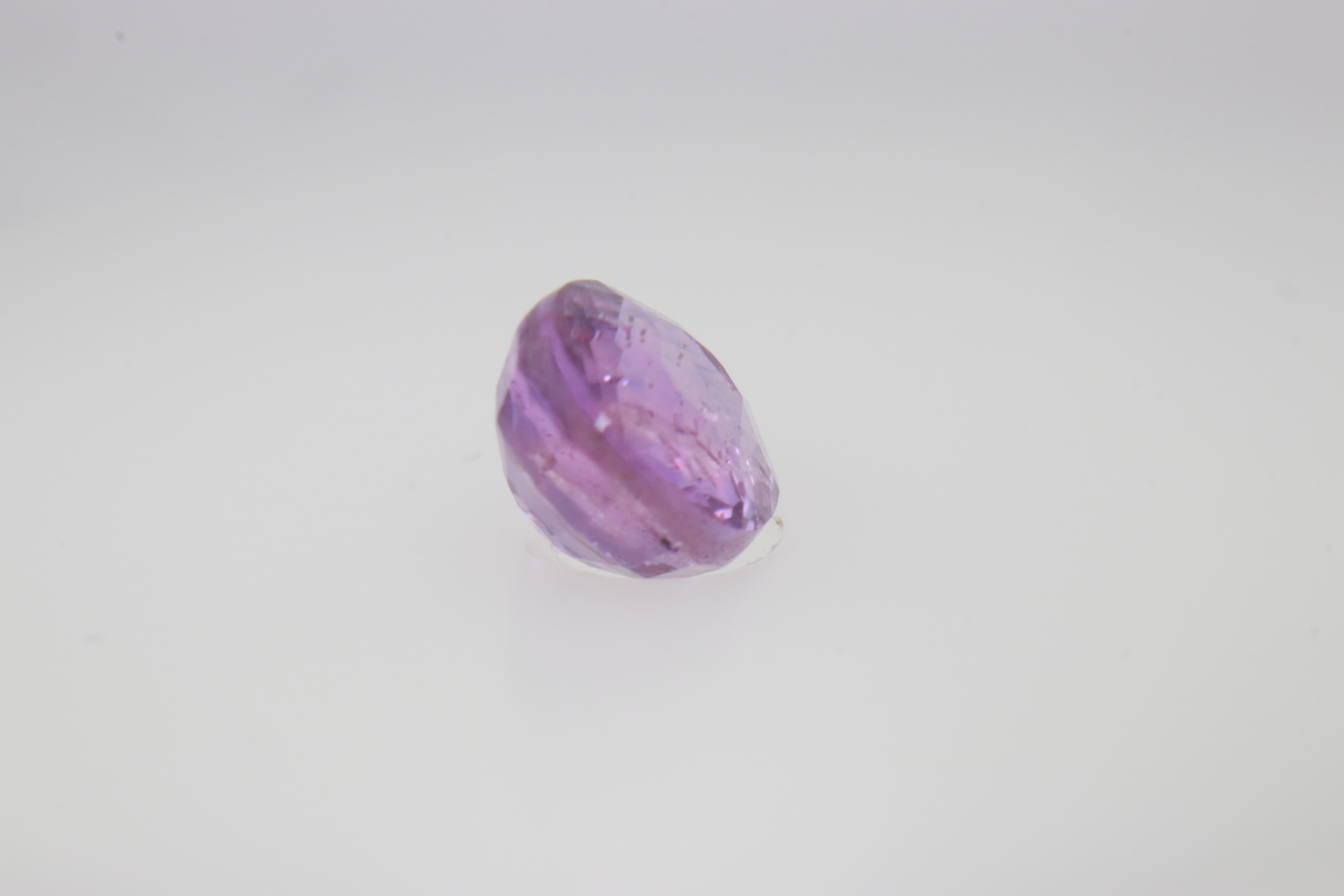 0.9ct Hot Pink Padparadscha VVS Oval Shape (5.8x4.8x3.5 mm) Unheated gemstone from Sri Lanka