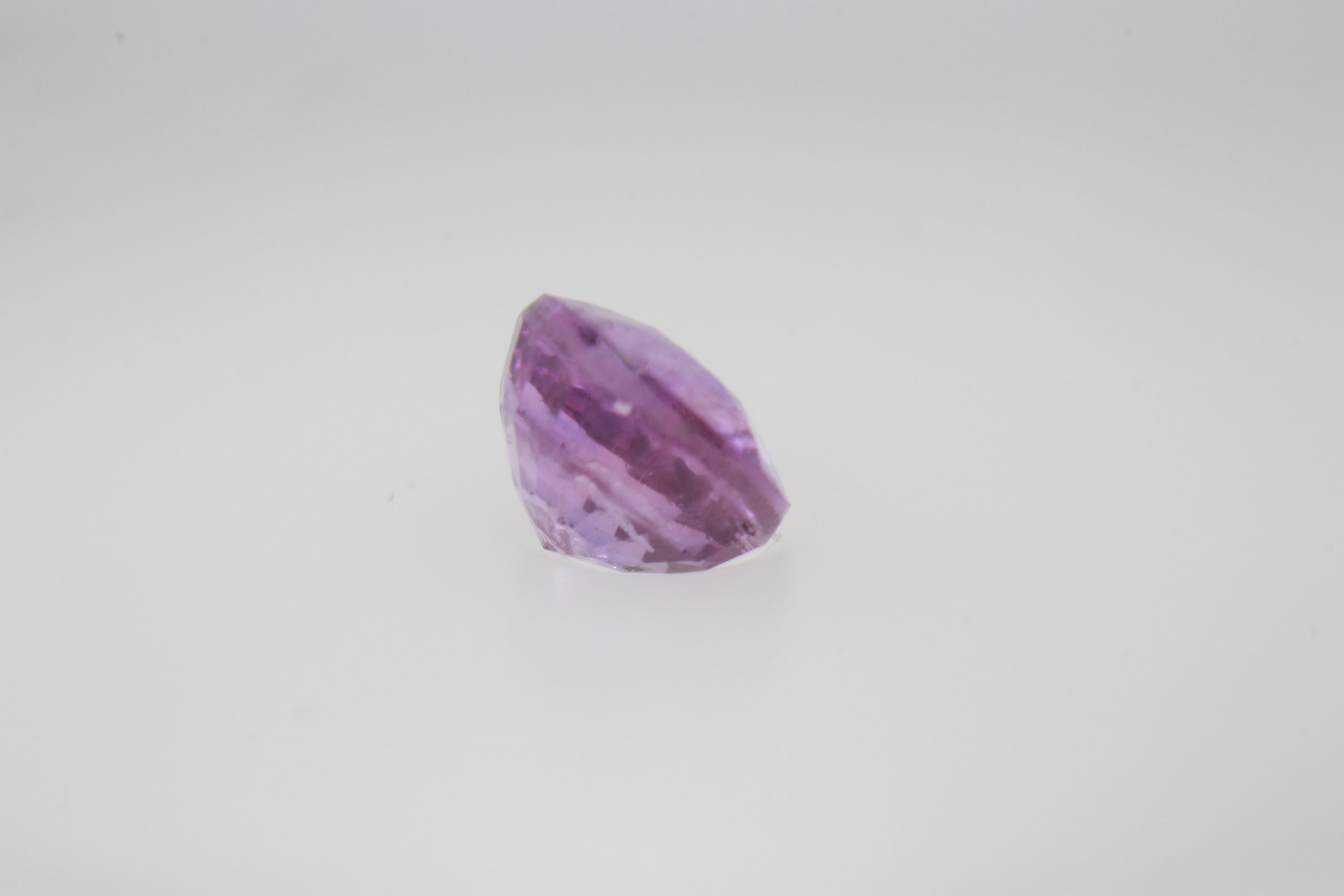 0.9ct Hot Pink Padparadscha VVS Oval Shape (5.8x4.8x3.5 mm) Unheated gemstone from Sri Lanka